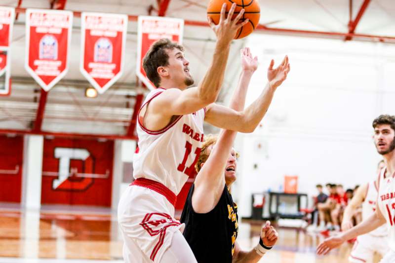 a basketball player in a white uniform playing basketball