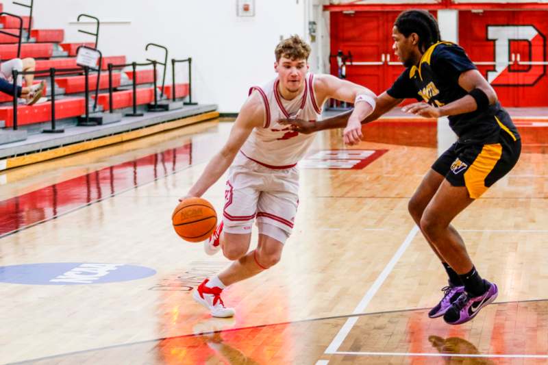 a man running with a basketball