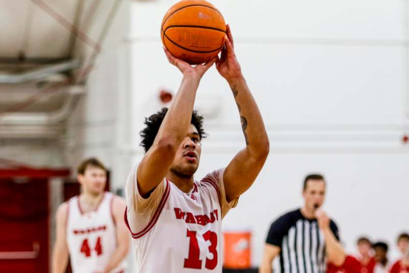 a man holding a basketball