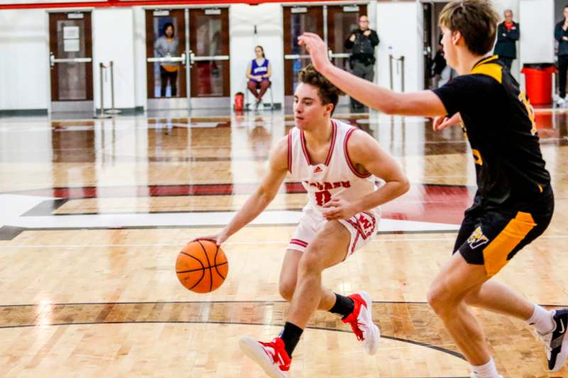 a basketball player dribbling a basketball