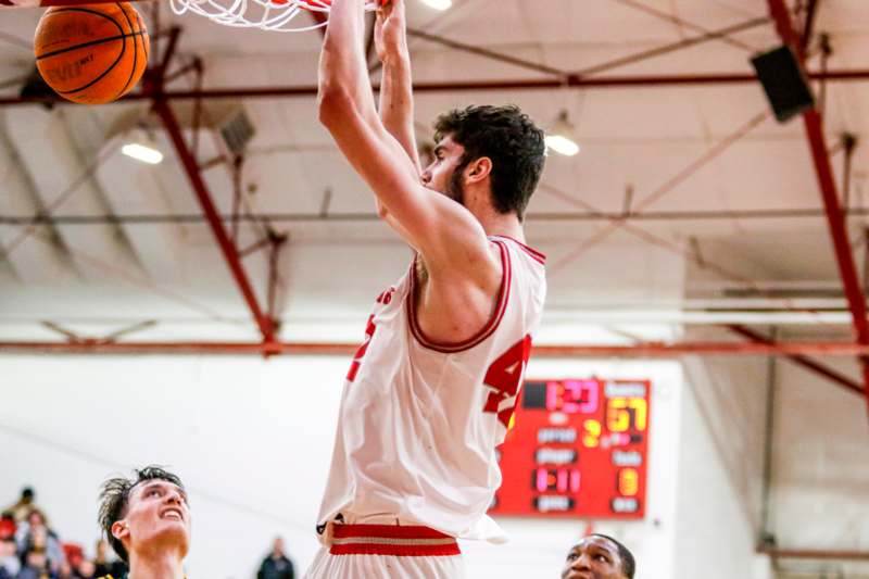 a basketball player dunking a basketball