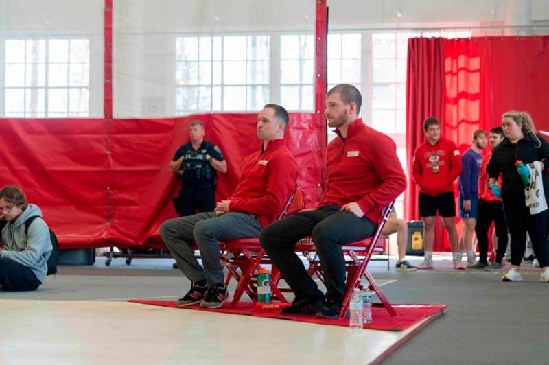 a group of men sitting in chairs