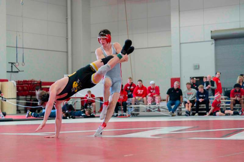 a man wrestling in a gym