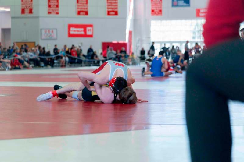 a man wrestling on the floor