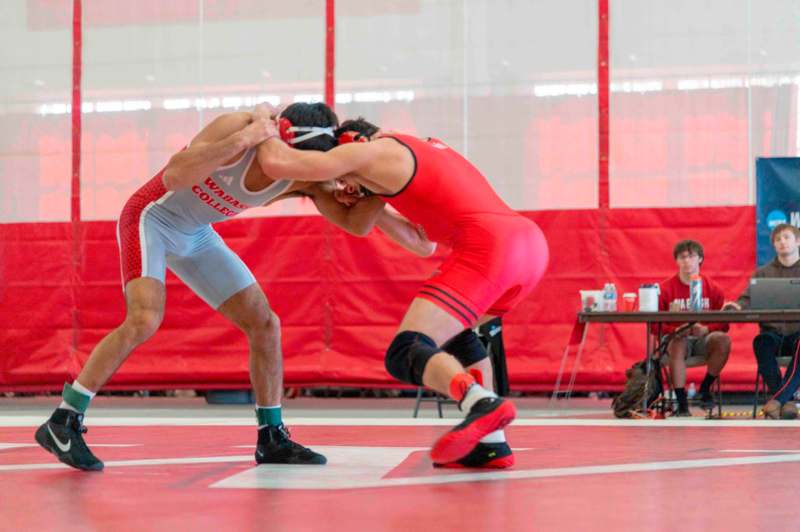 a man in a wrestling uniform