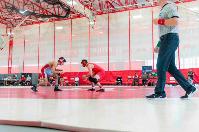 a group of people in a wrestling ring