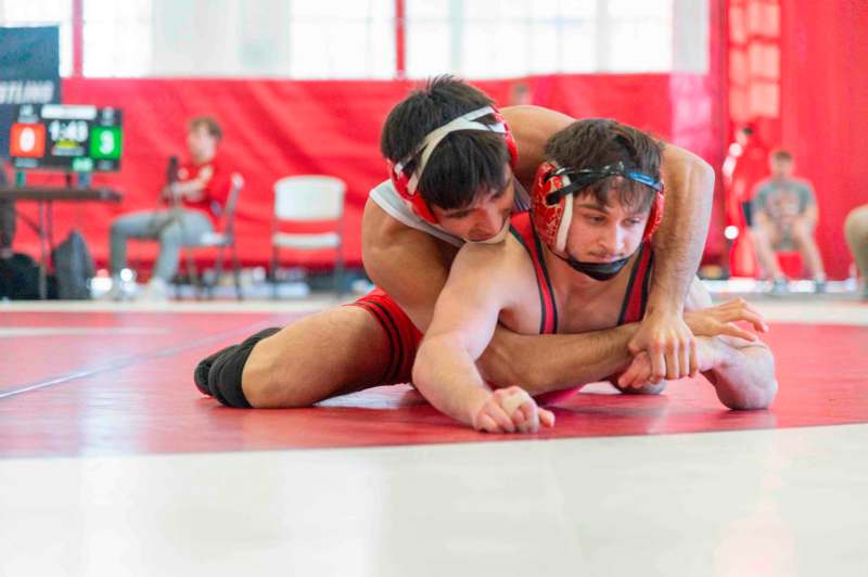 a man wrestling on the floor