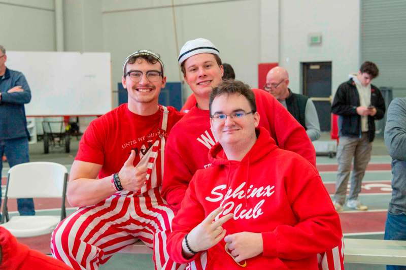 a group of men in red and white striped outfits