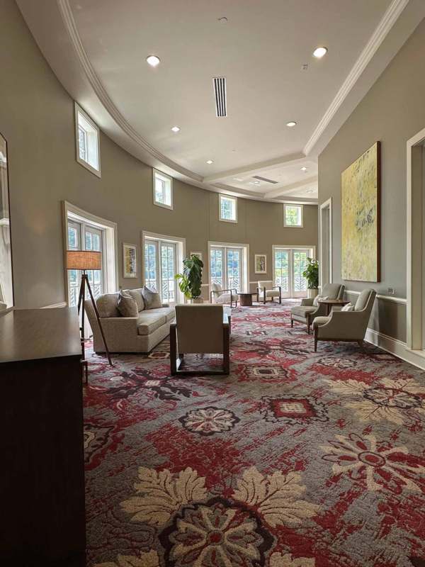 a room with a red and white patterned carpet