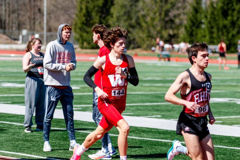 a group of people running on a track