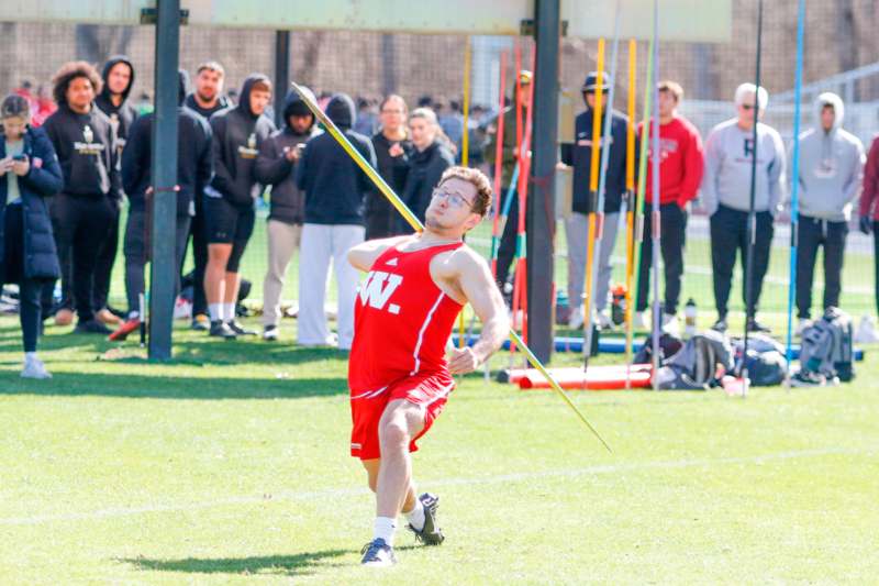 a man holding a javelin