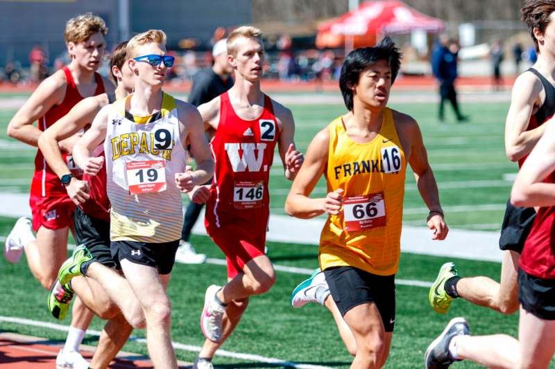 a group of people running on a track