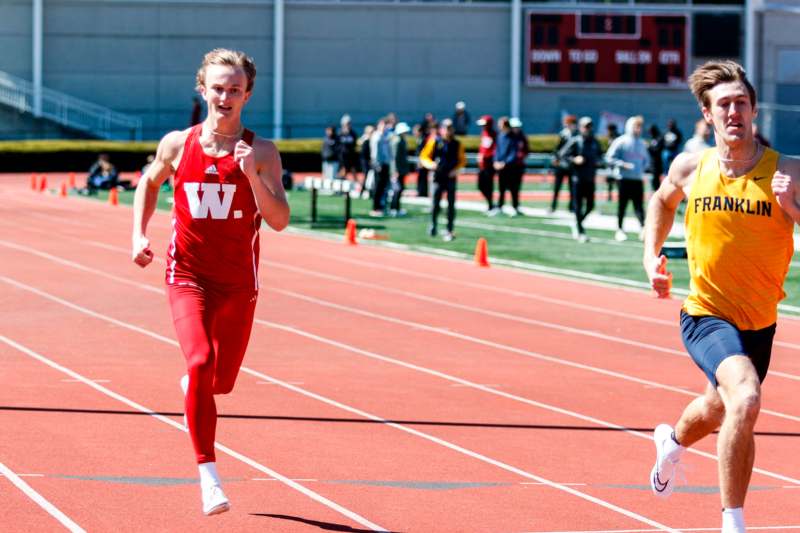 a group of people running on a track