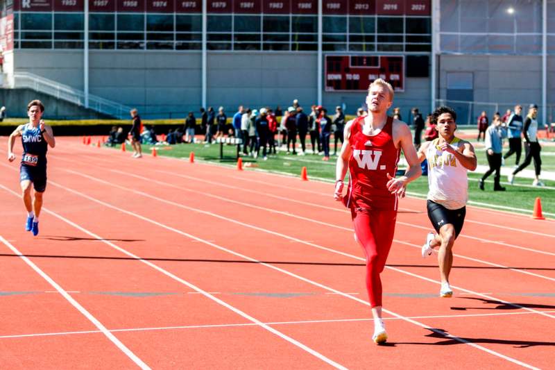 a group of men running on a track