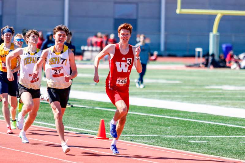 two men running on a track