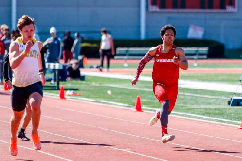 a group of people running on a track