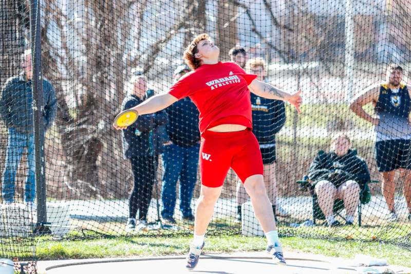 a man throwing a frisbee