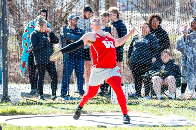 a man throwing a discus