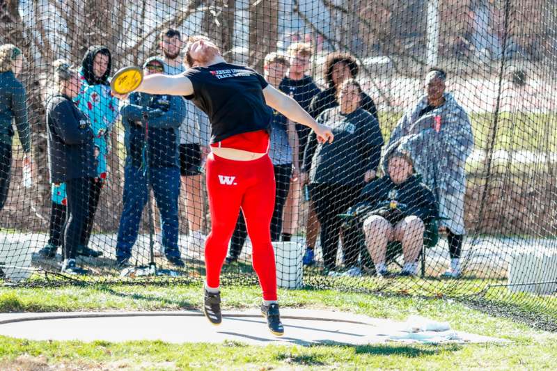 a man throwing a frisbee