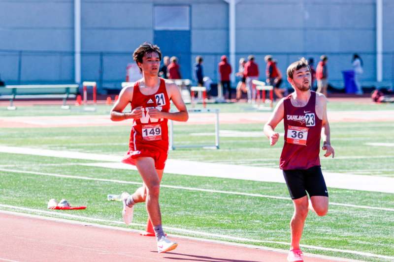 a group of people running on a track