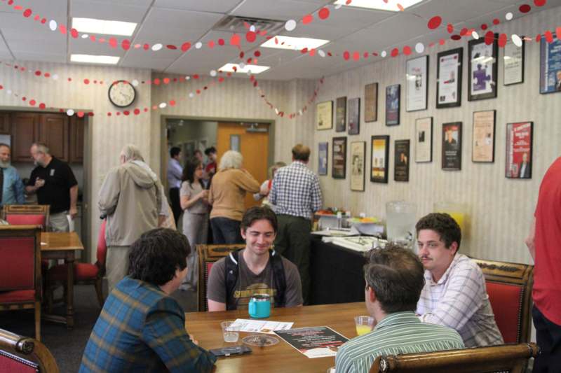 a group of people sitting at a table