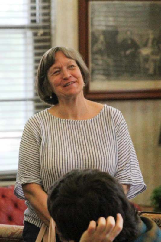 a woman smiling at a man