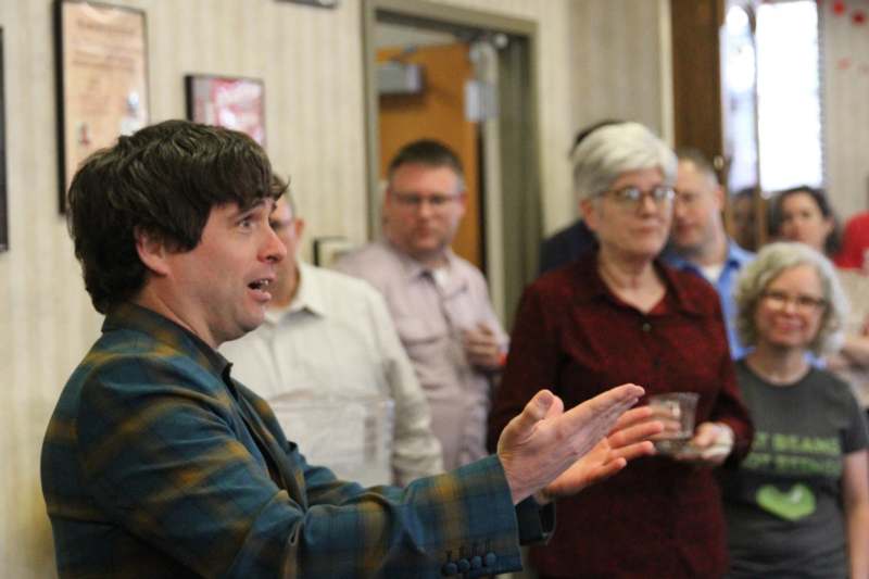 a man standing in front of a group of people