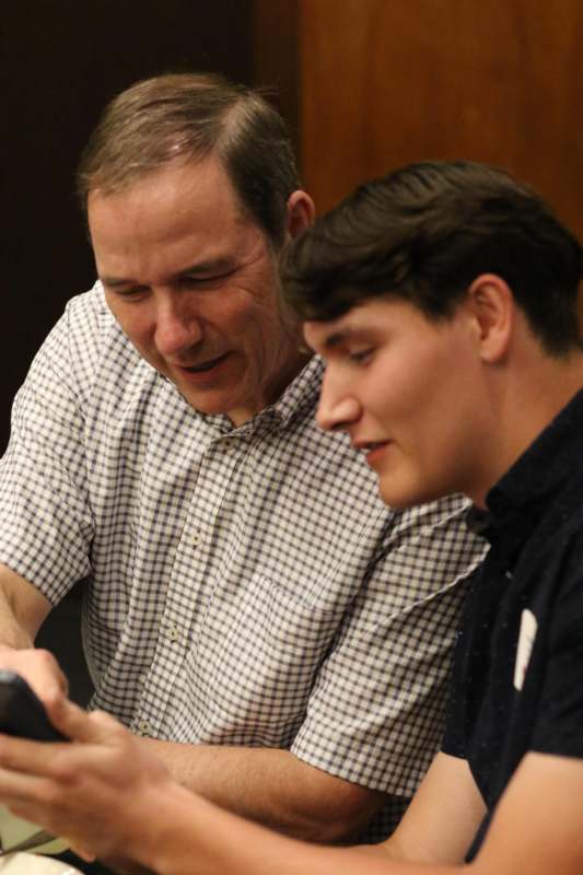 a man looking at a cellphone
