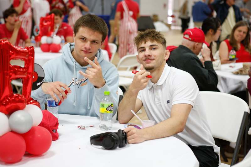 two men sitting at a table