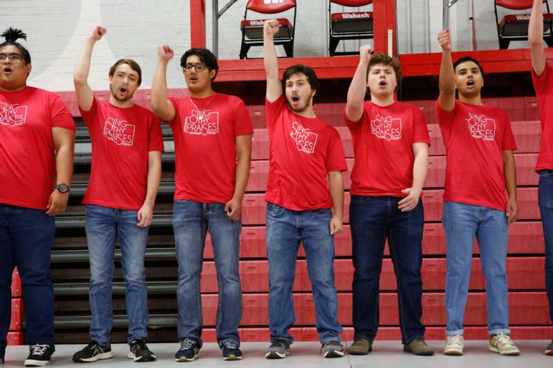 a group of men wearing red shirts