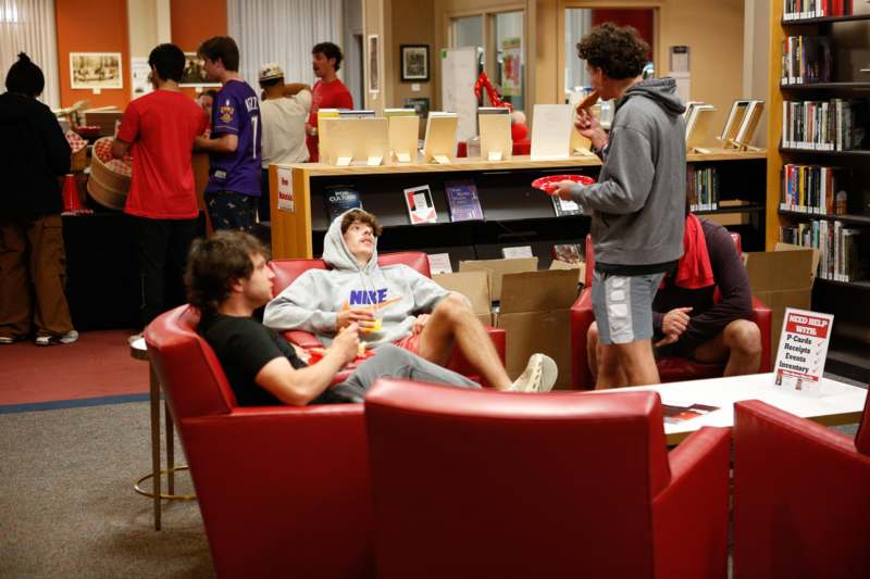 a group of people in a library