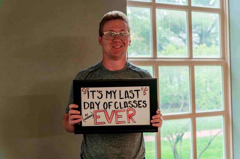a man holding a sign