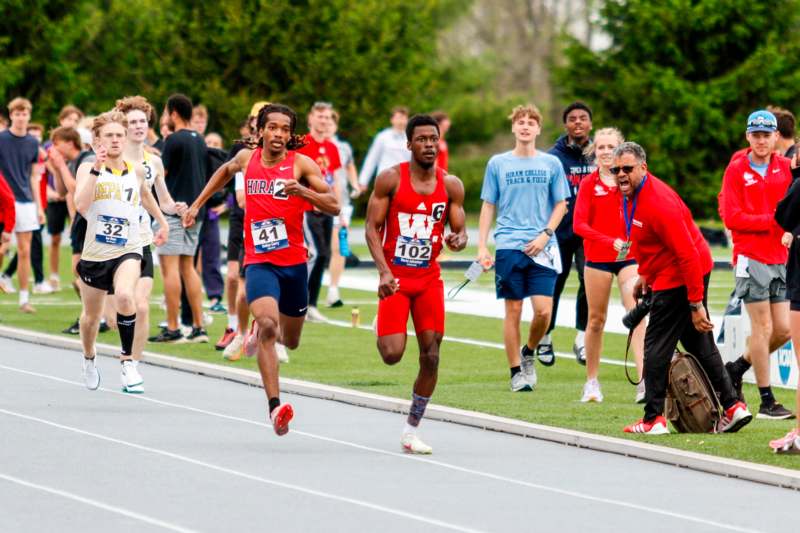 a group of people running on a track