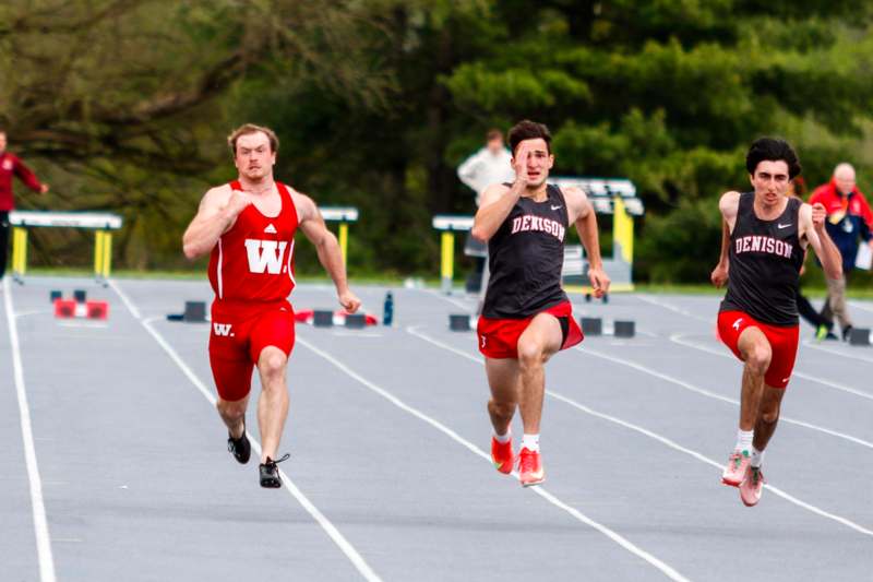 a group of men running on a track
