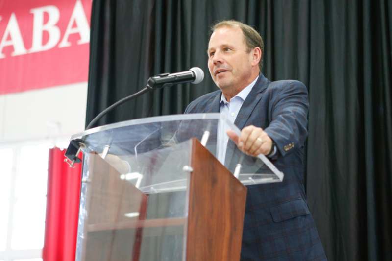 a man standing at a podium