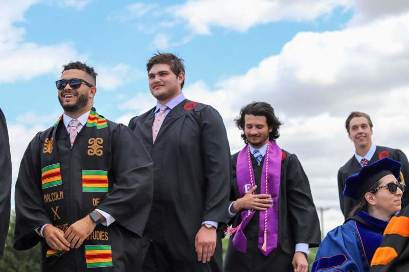 a group of people wearing graduation gowns