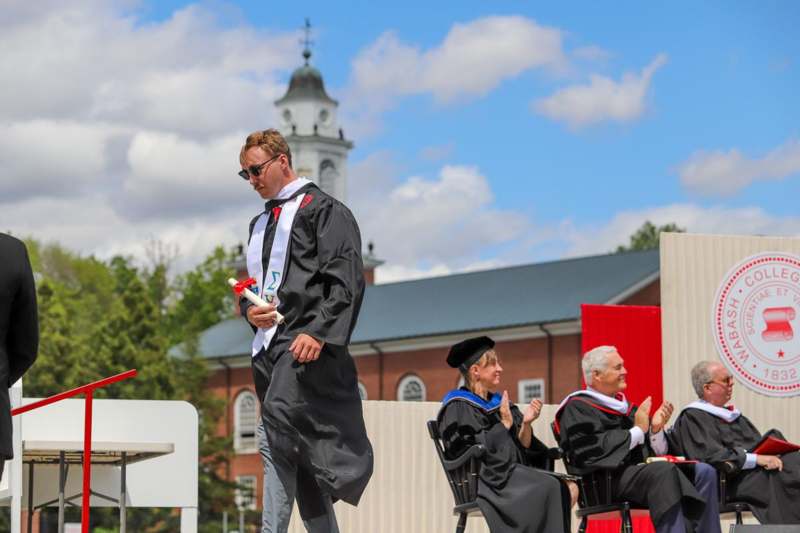 a man in a graduation gown