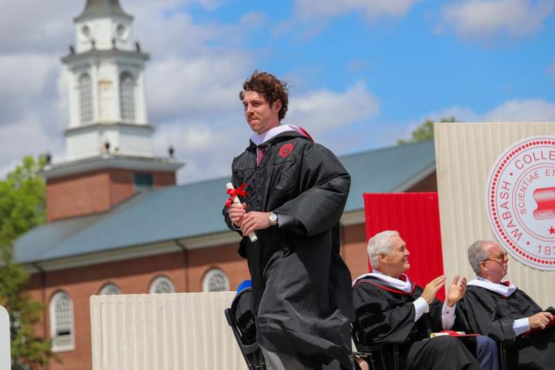 a man in a graduation gown