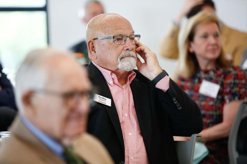 a man holding a phone to his ear