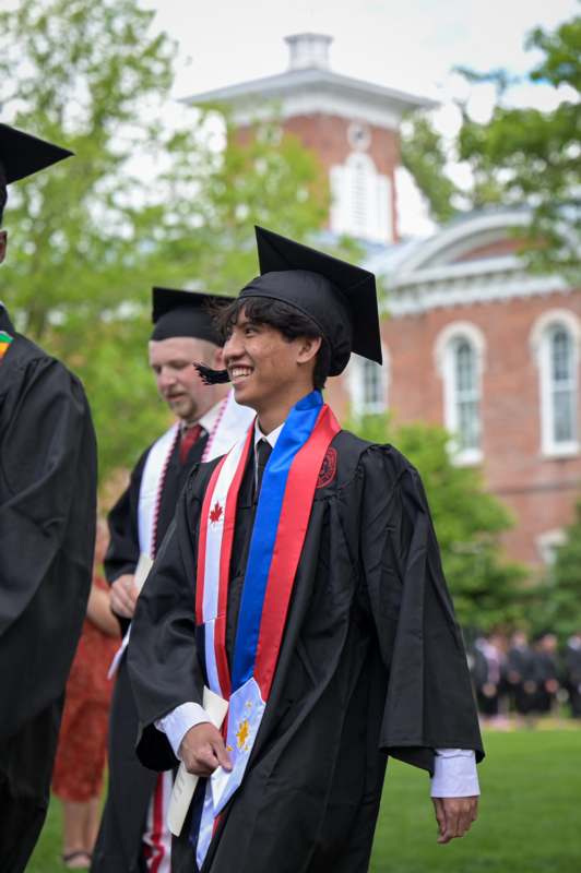 a man in a graduation gown