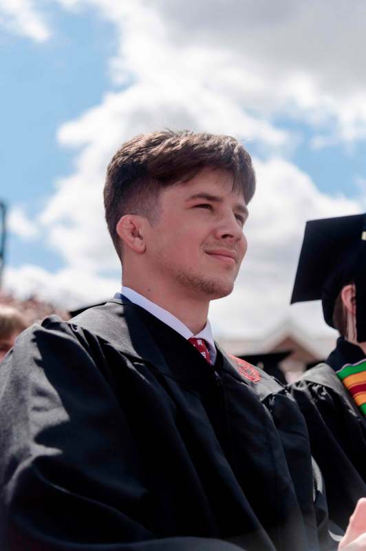 a man in a graduation gown