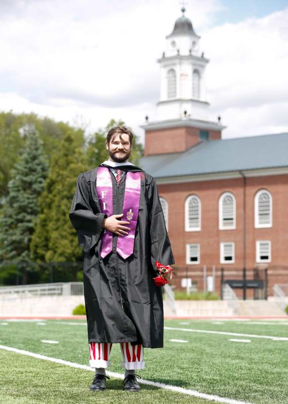 a man in a graduation gown