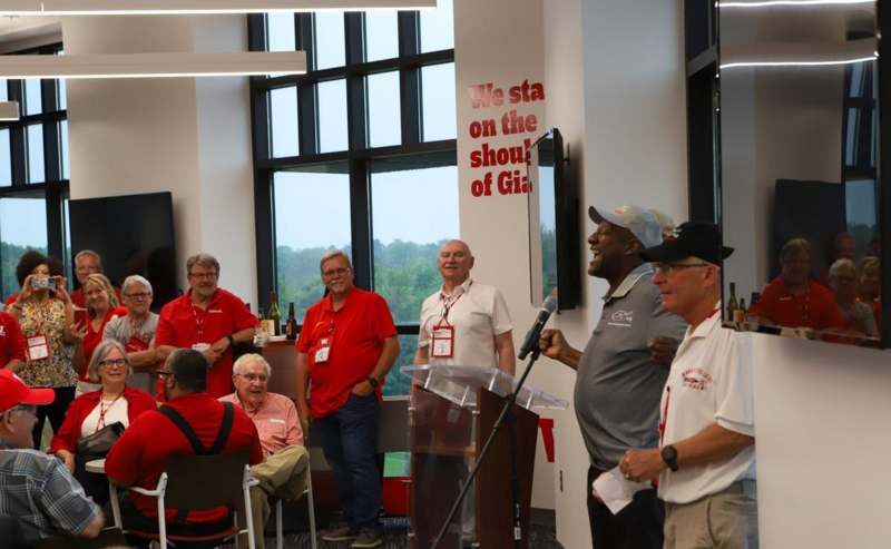 a group of men standing in front of a podium