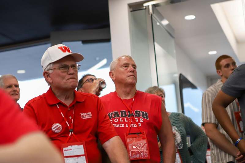 a group of men wearing red shirts
