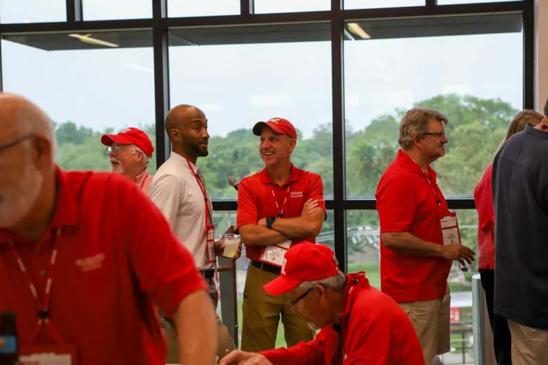 a group of men wearing red shirts