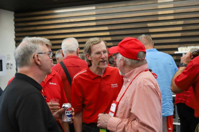 a group of men in red shirts