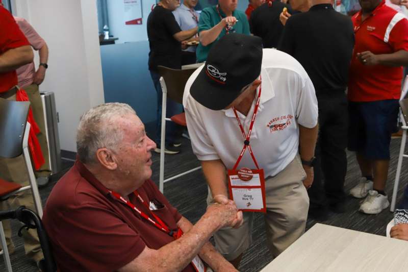 a man shaking hands with another man