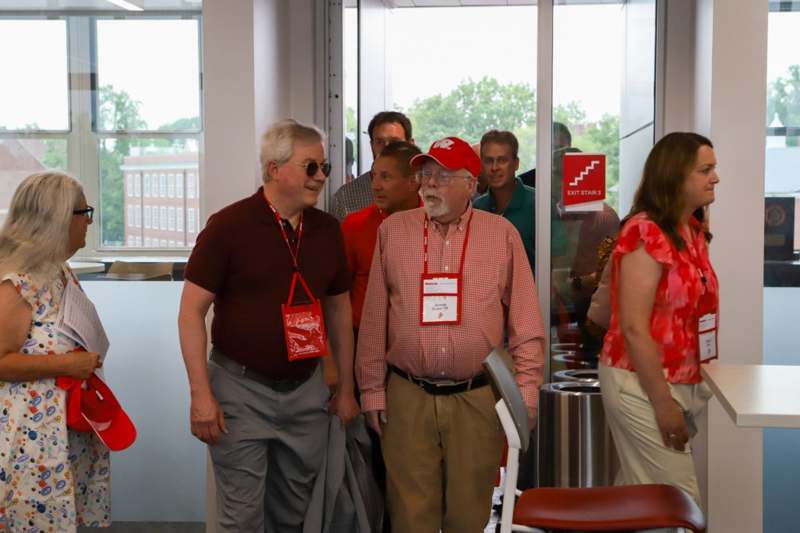 a group of people standing in a room