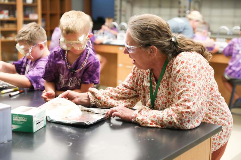 a woman and boy in a lab