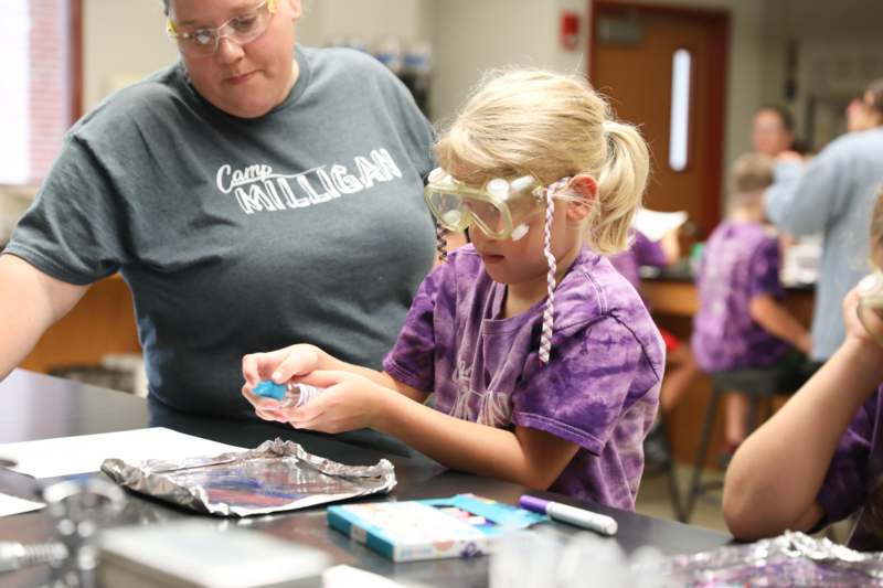 a girl wearing goggles and a mask
